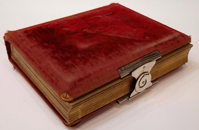 VICTORIAN ERA PHOTO ALBUM, 53 TINTYPES, CDV'S: American Victorian era red velvet covered family photo album, silver plate locking clasp, 53 photos of men women and children, many with identification notations, CDV's, tin types, album in poor condi