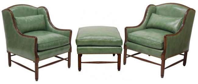 MINTON-SPIDELL LEATHER NORMANDY CHAIRS & OTTOMAN: (suite of 3) Minton-Spidell Custom Furniture, Los Angeles: (2) Normandy wing chairs, 37"h, 28"w, 27"d; (1) ottoman, 19"h, 28"w, 25"d; each in green leather upholstery affixed with brass tacks, cushion