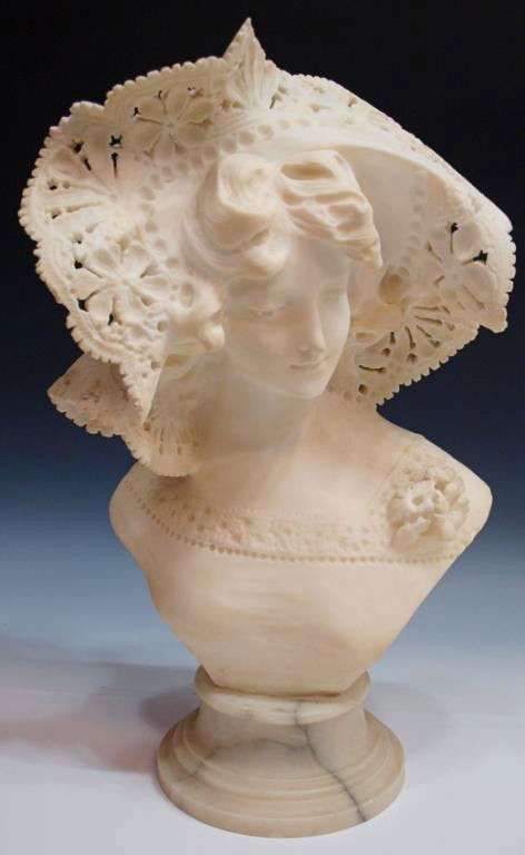 CARVED ALABASTER BUST ON MARBLE, LADY WITH HAT: Carved alabaster bust of a young woman, c. 1900, wearing a pierced carved hat, mounted on marble base, 17.5"h, 12.5"w, 9"d, 42.25lbs Start Price: $150.00