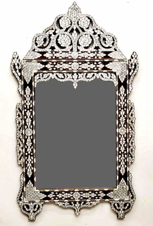ORNATE SYRIAN BONE & MOTHER-OF-PEARL WALL MIRROR: Ornate Syrian wall mirror, 20th c.,the frame with bone overlay and extensive inlays of mother-of-pearl inlay, minor loss, 48.25"h, 28.25"w, 18lbs total Start Price: $250.00