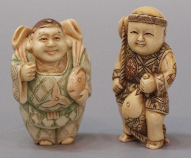(2) JAPANESE CARVED IVORY NETSUKES, FISHERMEN: **This item will not be shipped Internationally** (lot of 2) Japanese polychrome carved ivory netsukes, each formed as a man standing and holding fish, both with makers mark on the underside, each 2.1