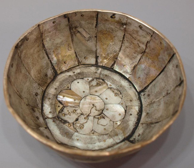 17TH C INDO-PORTUGUESE MOTHER-OF-PEARL SILVER BOWL: Indo-Portuguese mother-of-pearl bowl, Gujarat, 17th c., silver mountings on the rim and foot secured with brass pins, small old patch repair as pictured, 2"h, 4.5"diam, .25lb **Reference: A similar ex