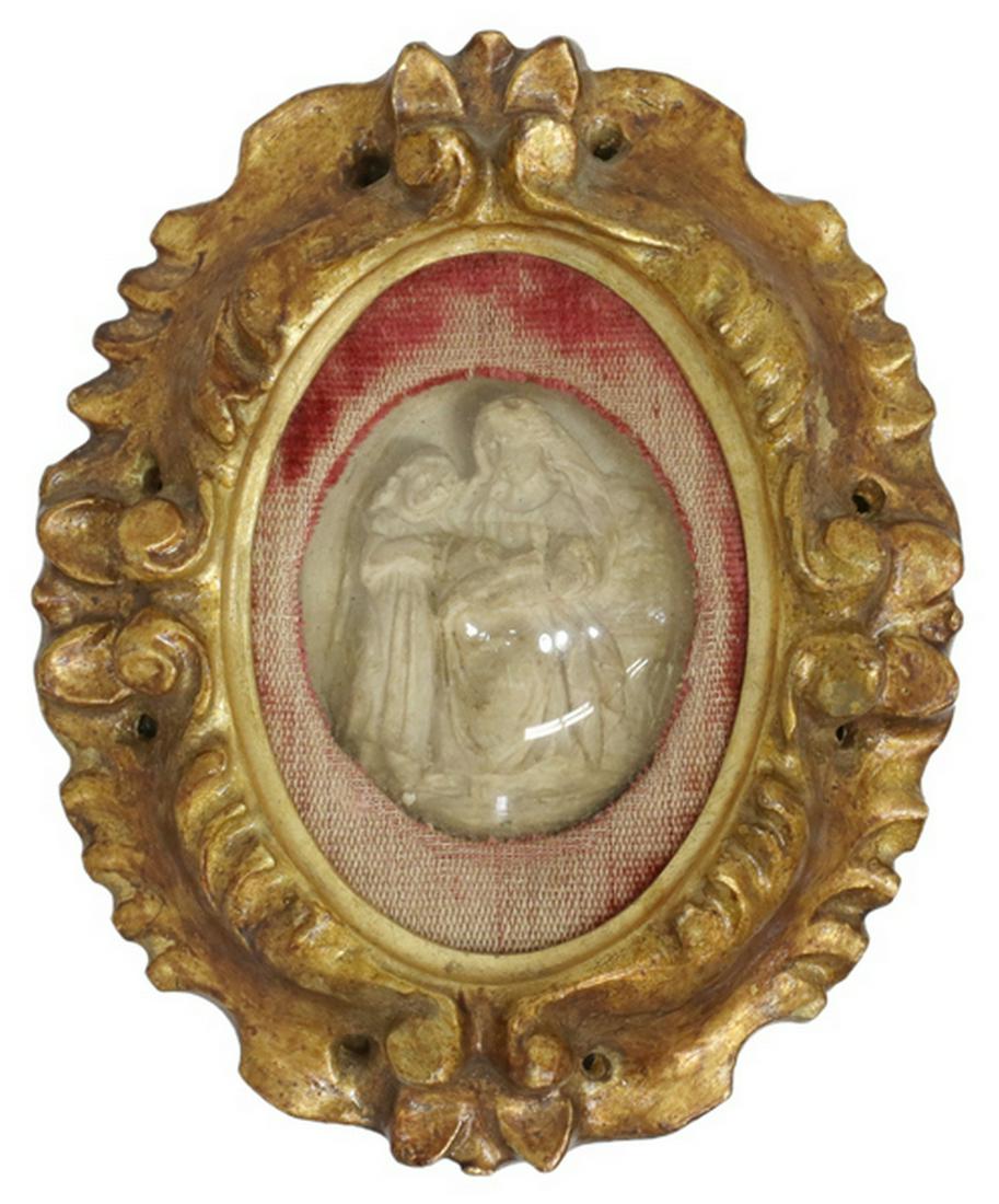 ITALIAN GILTWOOD RELIQUARY SAINT ANNE & THE VIRGIN: Italian giltwood framed reliquary, Saint Anne teaching the Virgin, possibly carved from bone, approx 4.75"h, 4"w, 86.1 grams Start Price: $80.00
