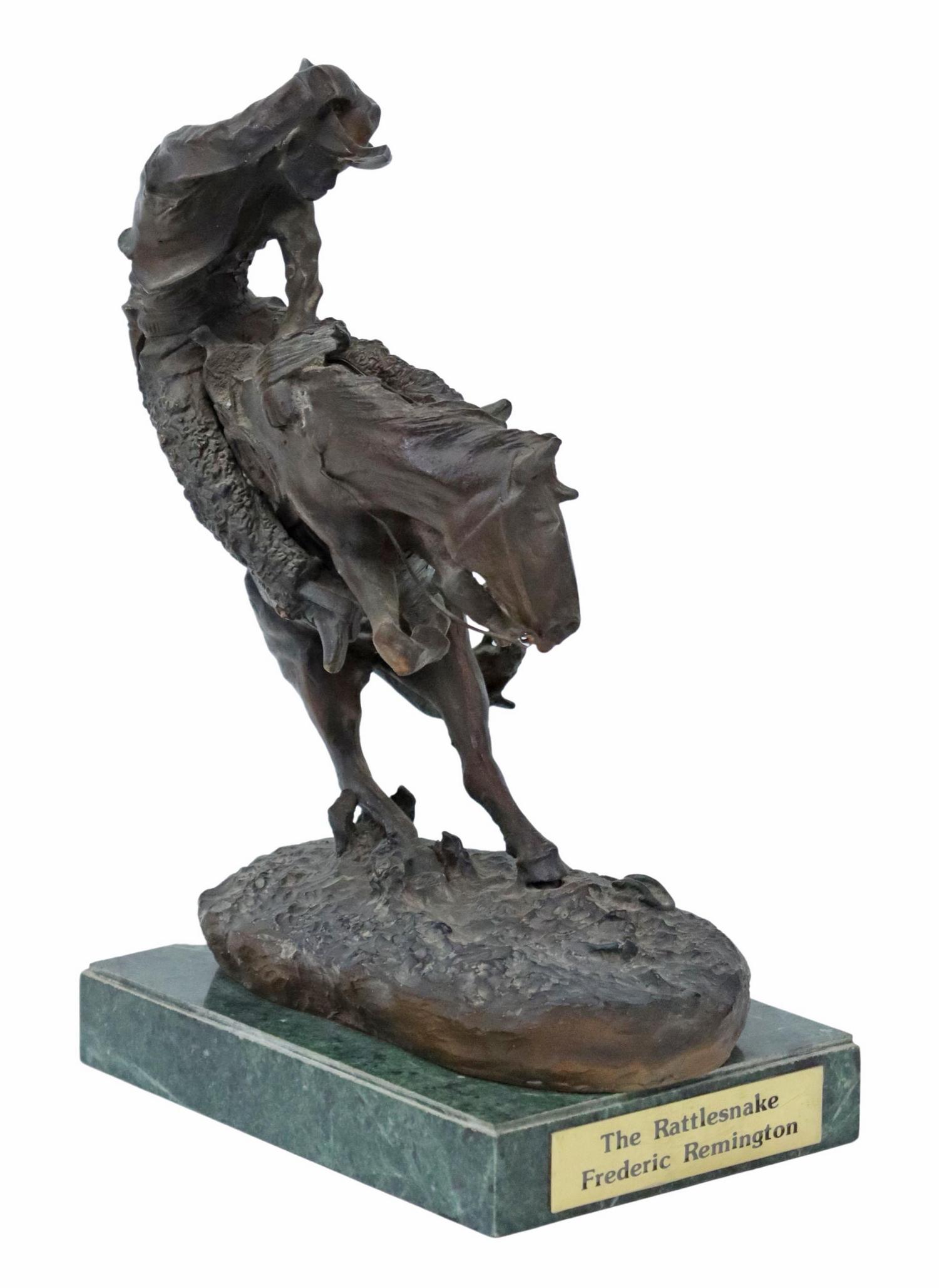 AFTER FREDERIC REMINGTON THE RATTLESNAKE BRONZE: Western patinated bronze sculpture, "The Rattlesnake," after the original by Frederic Sackrider Remington (American, 1861-1909), on a green marble base, overall: approx 12"h, 5"w, 6.75"d, 12.25lbs Sta
