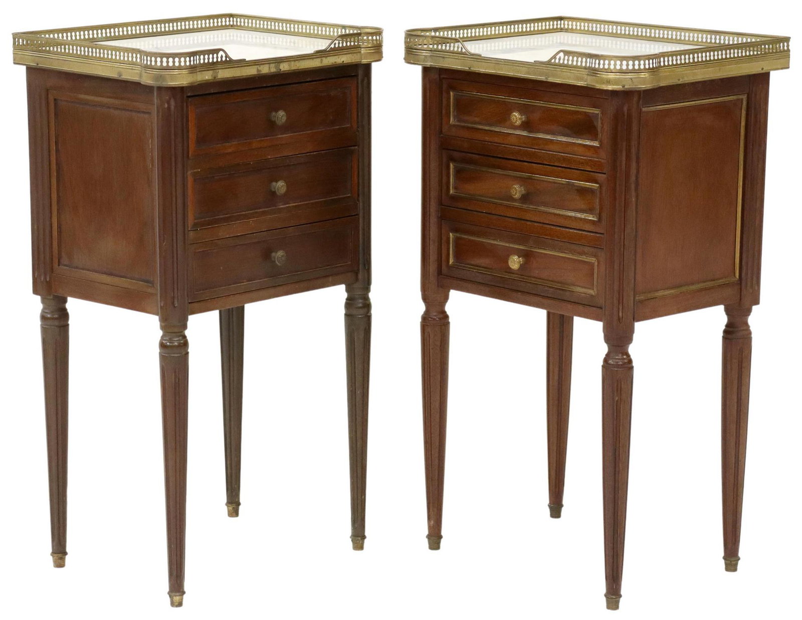 2) LOUIS XVI STYLE MARBLE-TOP MAHOGANY NIGHTSTANDS: (pair) French Louis XVI style mahogany nightstands, 20th c., pierced brass three-quarter gallery, enclosing the marble top, over three drawers, rising on tapered fluted legs, in a slightly varied desi