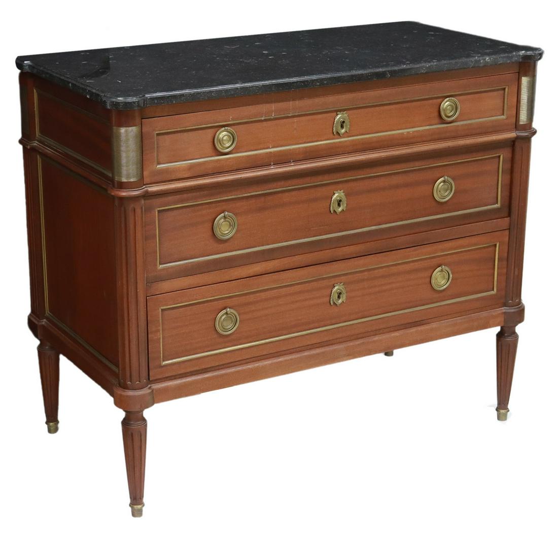 FRENCH LOUIS XVI STYLE MARBLE-TOP MAHOGANY COMMODE: French Louis XVI style marble-top mahogany commode, 20th c., three graduated drawers, fluted corner posts, rising on tapered legs, approx 33.5"h, 39.5"w, 20.25"d Start Price: $450.00