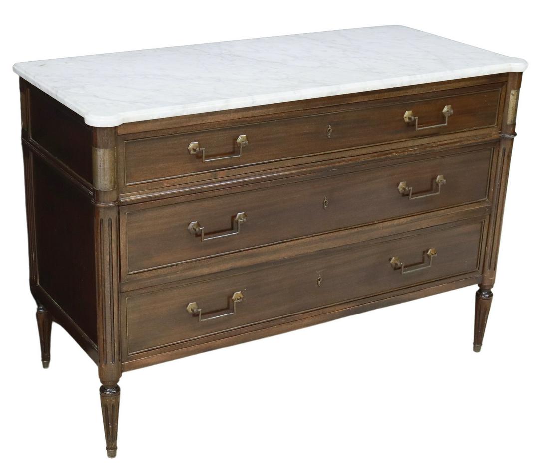 FRENCH LOUIS XVI STYLE MARBLE-TOP MAHOGANY COMMODE: French Louis XVI style marble-top mahogany commode, 20th c., three graduated drawers, framed by fluted corner posts, rising on tapered legs, approx 32.25"h, 46.75"w, 20.75"d Start Price: $600.00