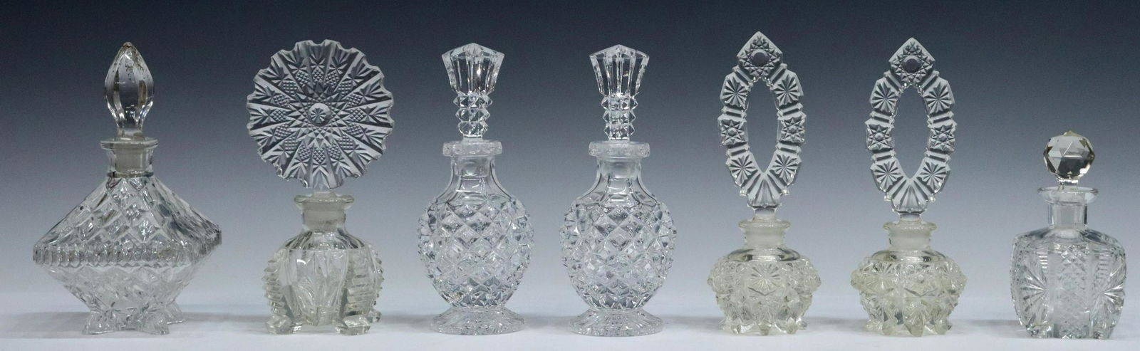 (7) MOLDED GLASS PERFUME SCENT BOTTLES (1 of 4)