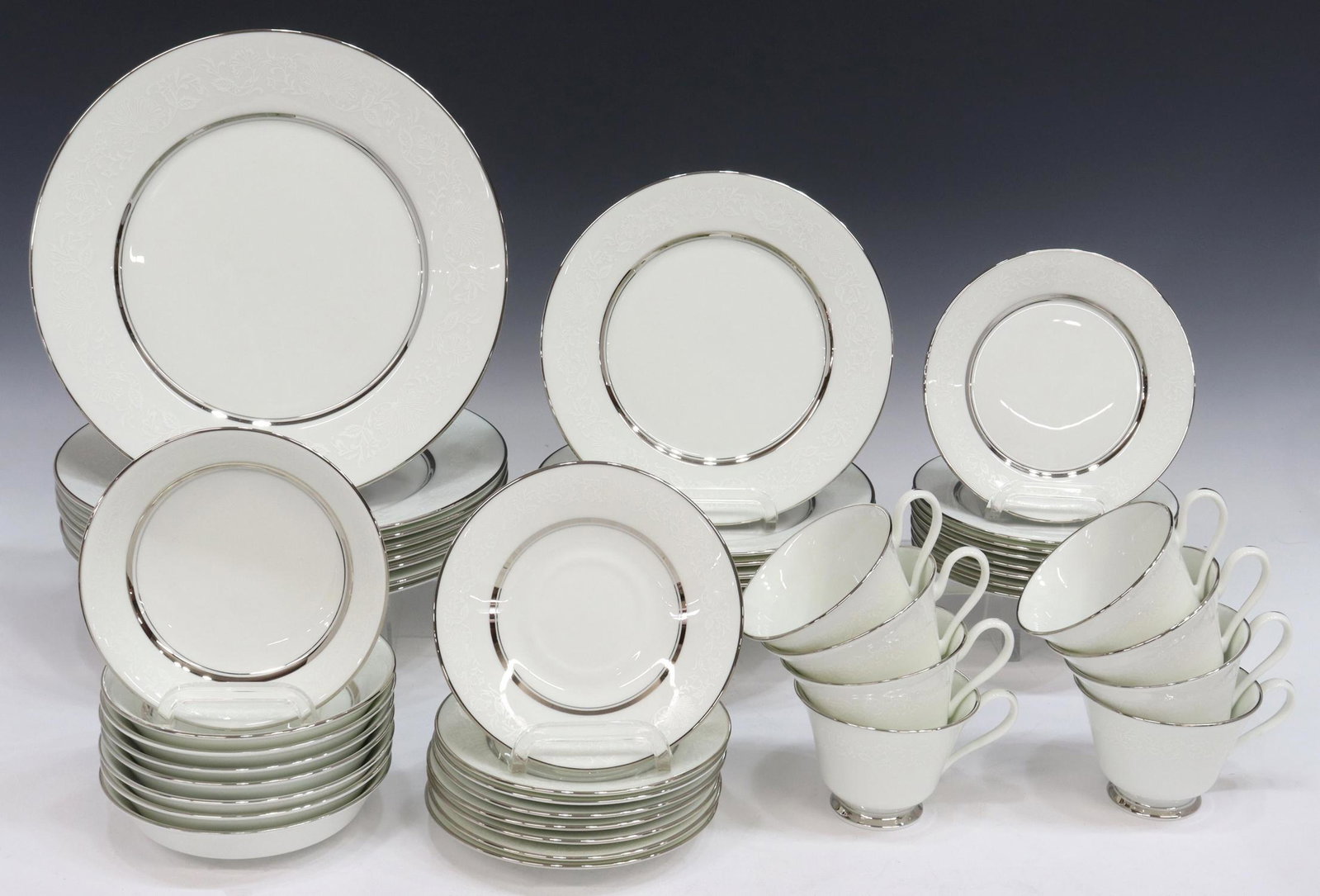 (48) OXFORD BONE CHINA 'WHITE ECHO' DINNER SERVICE: (lot of 48) Oxford bone china dinner service, in the "White Echo" pattern, including: (8) dinner plates, approx 10.75"diam; (8) salad plates, approx 8.25"diam; (8) bread and butter plates, approx 6.5"