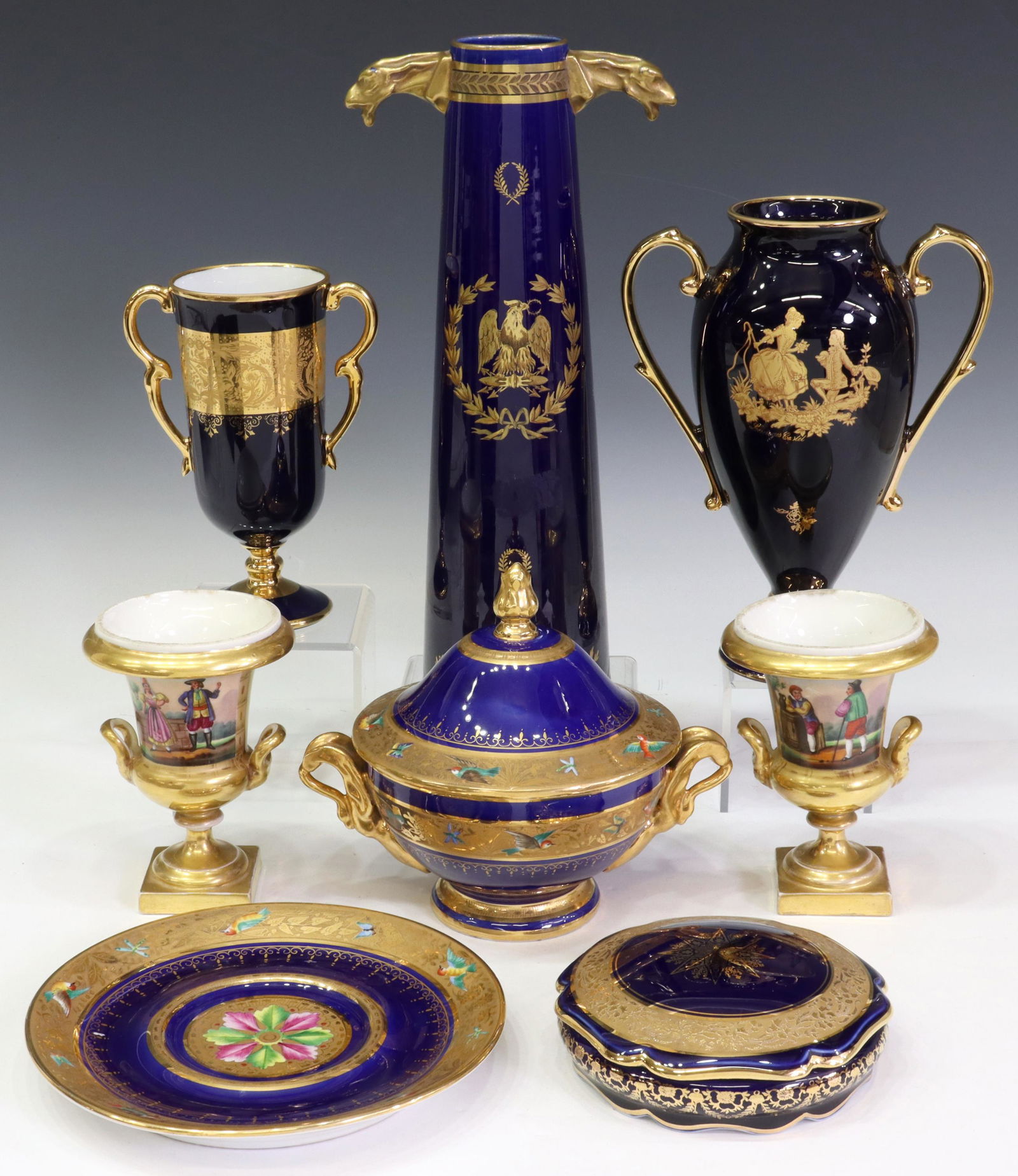 (7) FRENCH PORCELAIN VASES & BOXES, INCL. LIMOGES: (lot of 7) French porcelain decorative objects, mostly Limoges, 20th c., all having blue ground with gilt accents, including: (1) FM Limoges tapered vase, having figural gilt eagle head handles, over