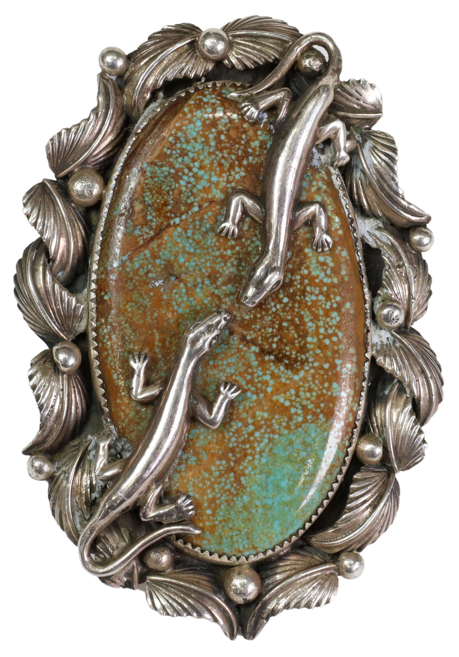 JACOB TRONCOSA SAN FELIPE TURQUOISE LIZARD RING: Gent's Native American sterling silver ring, Jacob Troncosa (San Felipe/ Cochiti Pueblo, 20th c.), large turquoise plaque overlaid with cast silver lizards, split shank with stamped designs, plaque: a