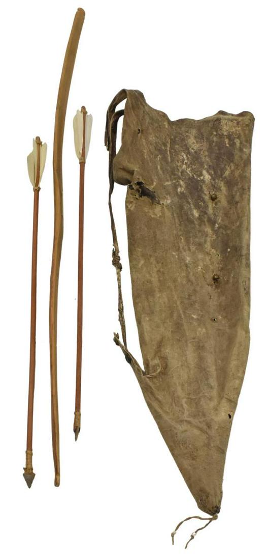 NATIVE AMERICAN DEER HIDE QUIVER, BOW & ARROWS: Native American deer hide quiver, possibly Navajo, c.1900-1940, with several brass beads, the hand-carved bow tagged "Navajo Child's Bow, 1920," bow approx 35.5"l, some polychrome work on inside; (3) 