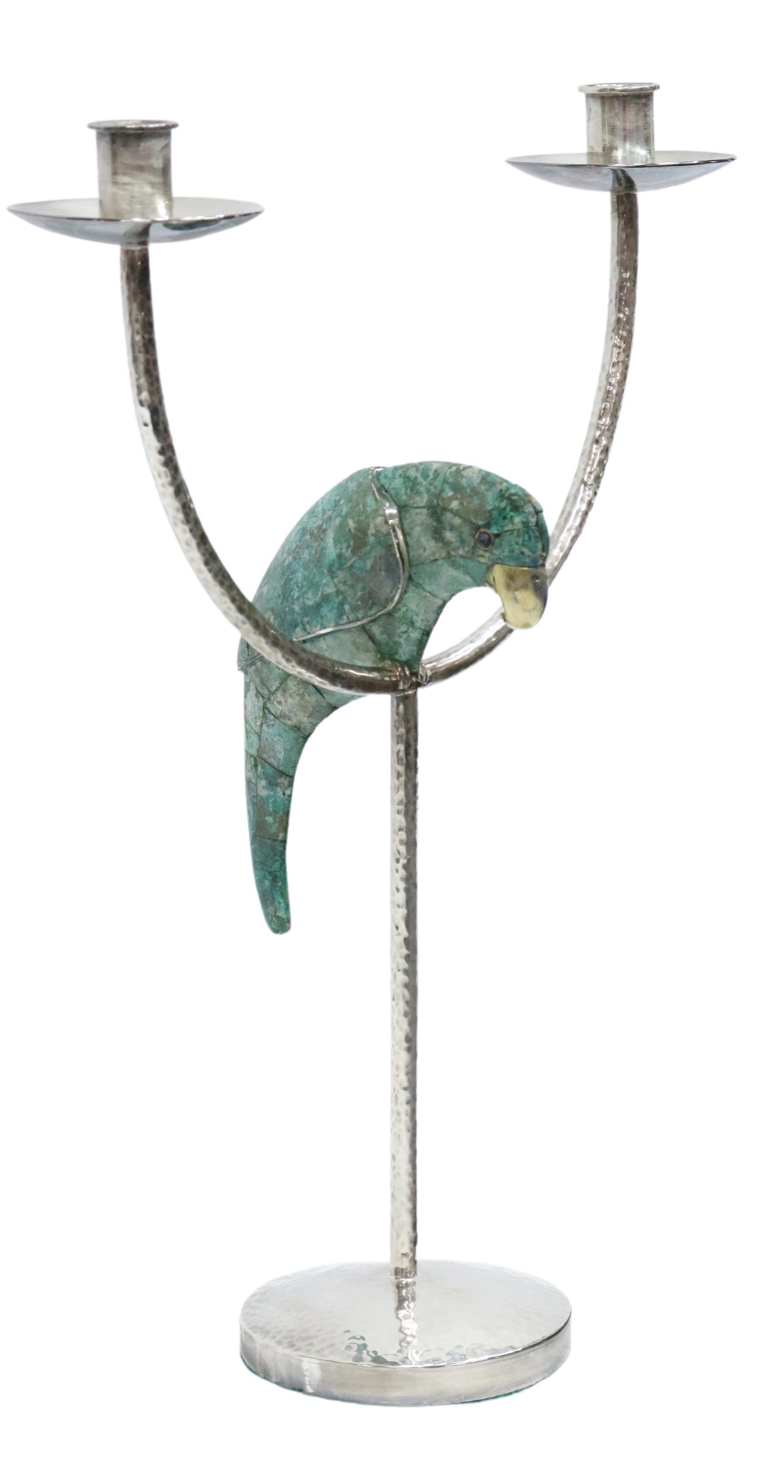EMILIA CASTILLO SILVERPLATE PARROT CANDELABRUM: Hammered silverplate toucan candelabrum, Emilia Castillo (Taxco, Mexico, b.1958), having two candle sockets, above perched parrot with mosaic inlay, marked underfoot "Emilia Castillo Mexico MR Platead