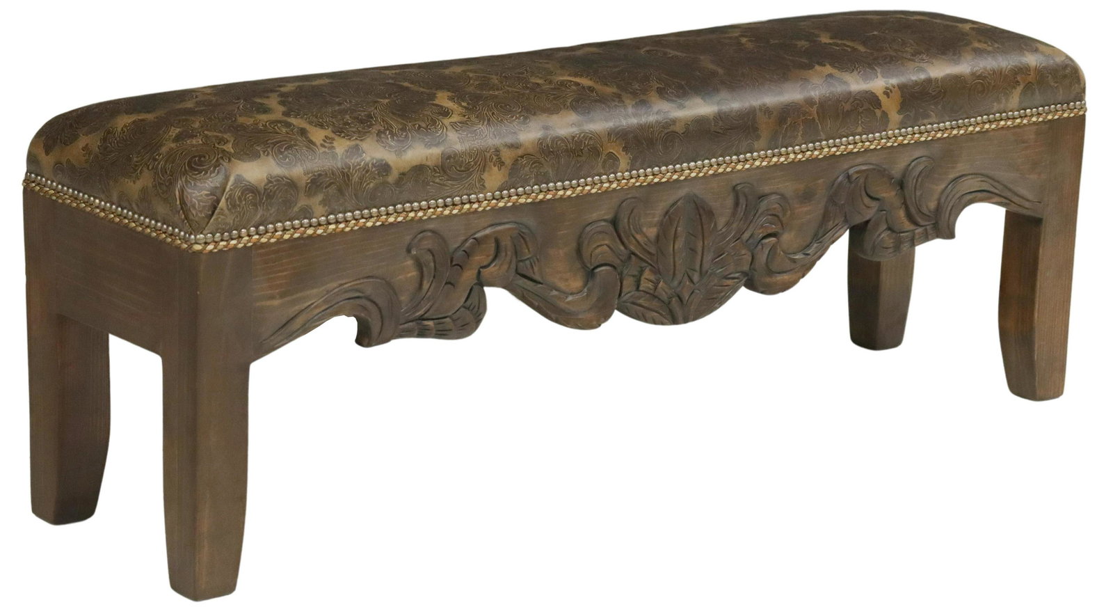 JORGE KURCZYN 'SAN CLAUDIO' END OF BED BENCH: Southwest style "San Claudio" end of bed bench, Jorge Kurczyn, Hacienda Santa Klara, damask patterned leather upholstered seat, with nailhead trim, over carved foliate apron, rising on tapered legs, a