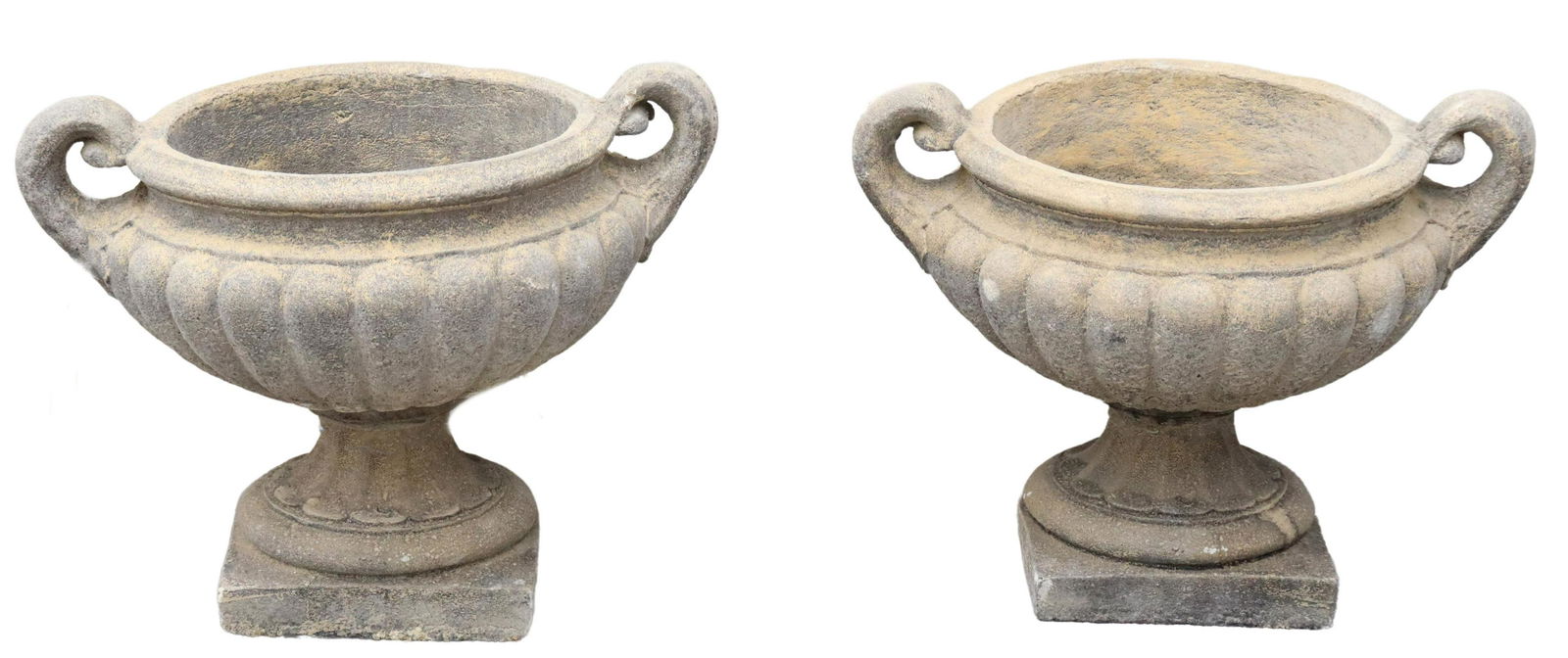 (2) LARGE CAST STONE HANDLED GARDEN URNS, 19"H: (lot of 2) Cast stone garden urns, late 20th c., each having melon ribbed body, dual side handles, fluted base, over squared base, approx 19"h, 22"w (to handle), 16"diam **PLEASE NOTE: All of the cast