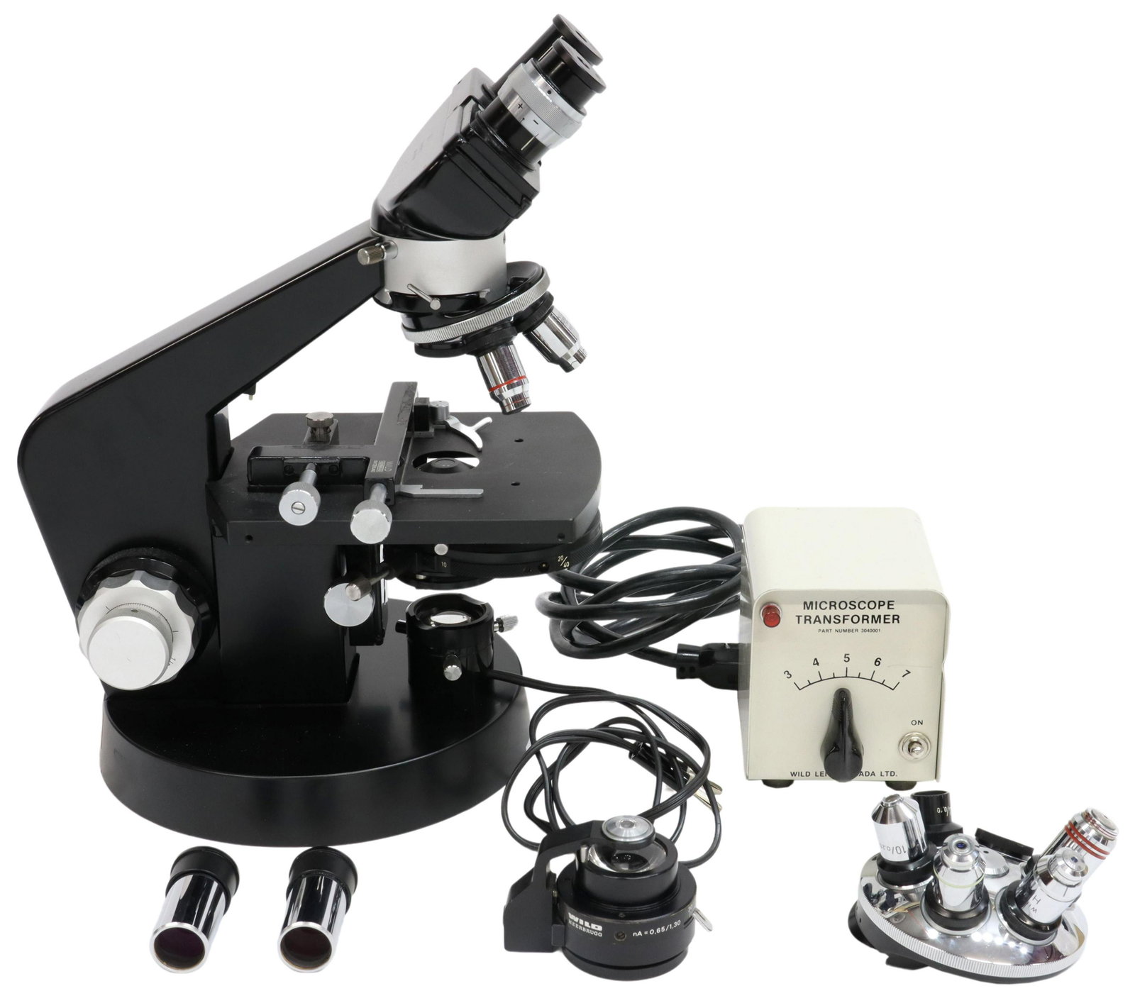 SWISS HEERBRUGG WILD M12 MICROSCOPE & ACCESSORIES: (lot) Swiss microscope and accessories, Heerbrugg Wild AG, including: (1) M12 binocular microscope, serial number 103540, fitted with two 10X eyepieces, rotating nosepiece with 10X, 40X, and 100X obje