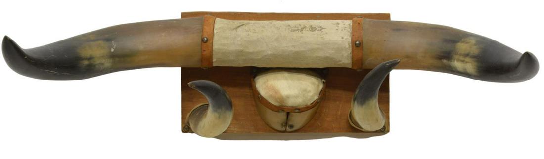 LONGHORN STEER TROPHY RACK, 26"W: Longhorn steer trophy rack, the center wrapped with cowhide and leather bands, accompanied by additional horns and hoof, on wood mount, approx 26"w, 4.5lbs Start Price: $50.00