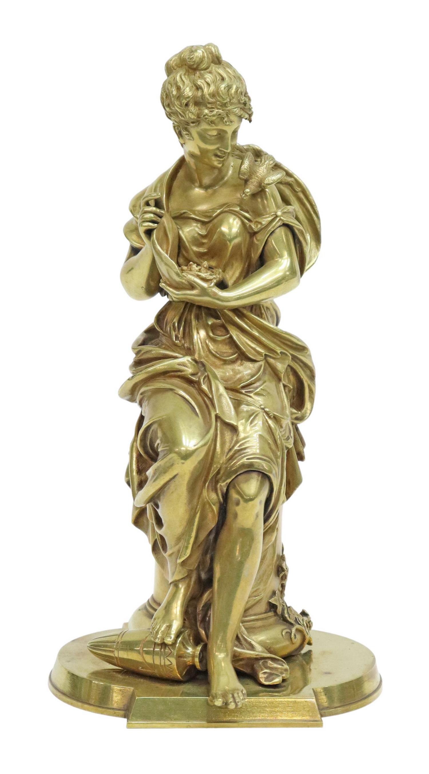 AFTER EMILE BRUCHON (D.1895) GILT BRONZE SCULPTURE: Gilt bronze sculpture, Young Woman Holding a Bird's Nest, signed in cast Bruchon (Emile Bruchon, French, 1806-1895), approx 11.5"h, 6"w, 5.25"d, 7lbs Start Price: $300.00