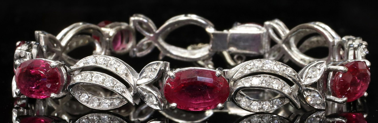 ESTATE 18K WHITE GOLD TOURMALINE DIAMOND BRACELET: Estate 18kt white gold link bracelet, seven pink tourmalines, alternating links set with numerous small diamonds, clasp stamped 18K GB04 (?), one diamond-set link near clasp with loss to metal, approx
