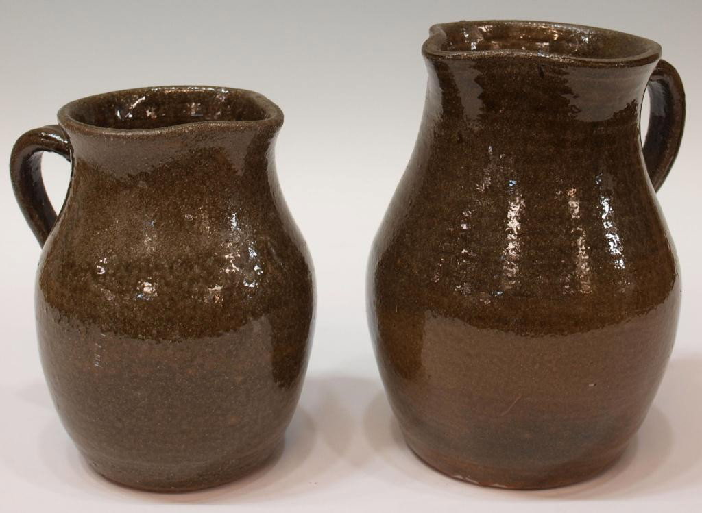 PAIR EDWIN MEADERS GEORGIA FOLK POTTERY PITCHERS: (lot of 2) Georgia folk pottery pitchers, Edwin Meaders, varied size, each in an alkaline glaze, largest: 8.5"h, smaller: 7"h, 5.5lbs Start Price: $100.00