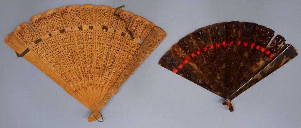 (2) CHINESE FANS, TORTOISE SHELL, FIGURAL CARVED: ***This item will not be shipped Internationally*** (lot of 2) Chinese fans: (1) tortoise shell with (15) pierced interior slats joined by a shell clasp and red ribbon, the ribbon apart in some places