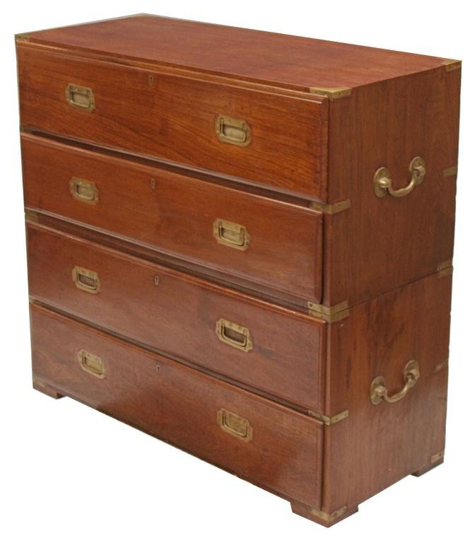 BRITISH COLONIAL TEAKWOOD CAMPAIGN SECRETARY CHEST: Antique British Colonial teakwood campaign secretary chest in two-parts, 19th c., the top drawer opening to reveal a secretary fitted with three drawers, hidden storage and cubby slots, above three lo