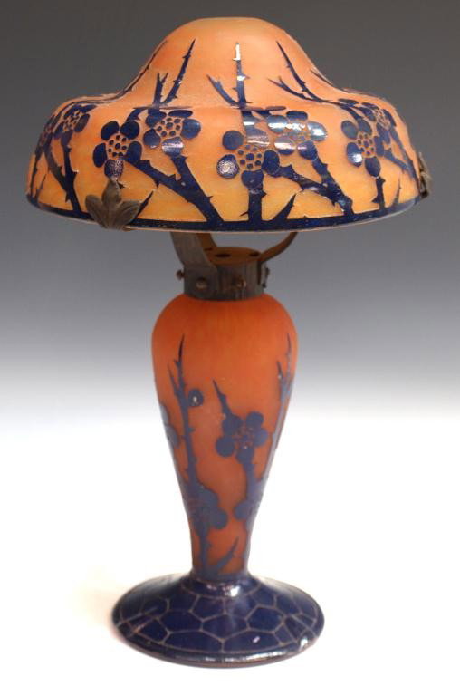 LE VERRE FRANCAIS ART GLASS CAMEO TABLE LAMP: Le Verre Francais cameo art glass table lamp, deep blue flowering stems on an orange ground, base bearing the candy cane mark, needs wiring, 16"h, 6.5lbs Start Price: $100.00