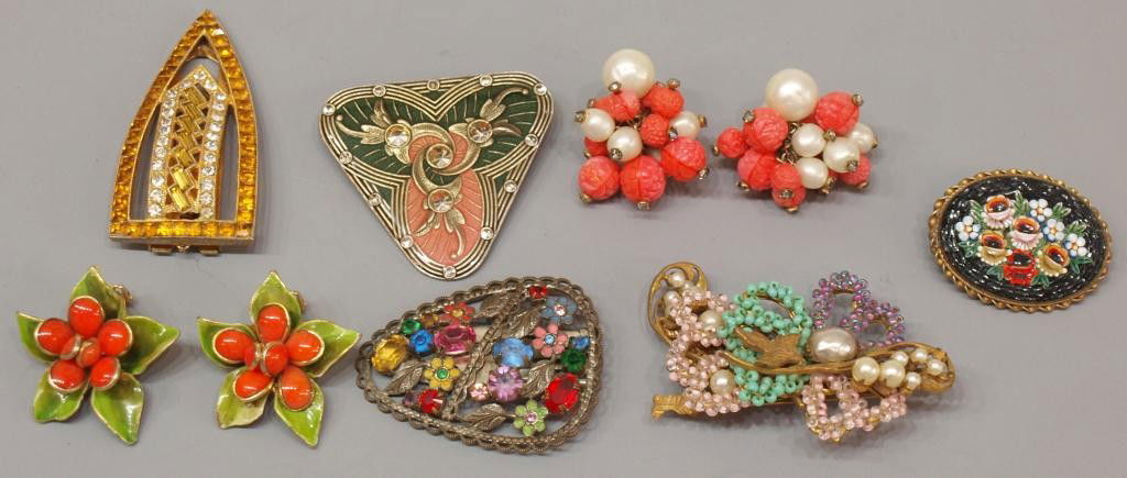 VINTAGE JEWELRY: MIRAM HASKELL, HATTIE CARNEGIE: (lot of 9) Collection of mostly vintage jewelry comprising: (pair) Hattie Carnegie floriform enamel earrings, clip; (pair) decorative clip earrings with carved and faux bead earrings; (1) Miriam Haske