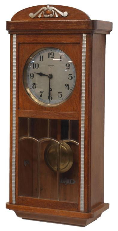 FRENCH OAK CASED WALL CLOCK, VEDETTE: French oak cased wall clock, Vedette time and strike works, operating, 29"h, 12.75"w, 7"d, 19.5lbs Start Price: $100.00