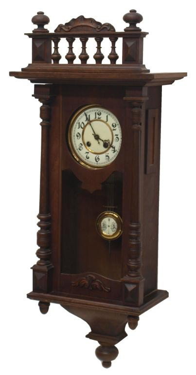 GERMAN KIENZLE WALNUT CASED WALL CLOCK: German walnut cased wall clock, porcelain face and dial, Kienzle One Million time and strike works, operating, 36"h, 15.25"w, 9"d, 13.75lbs Start Price: $100.00