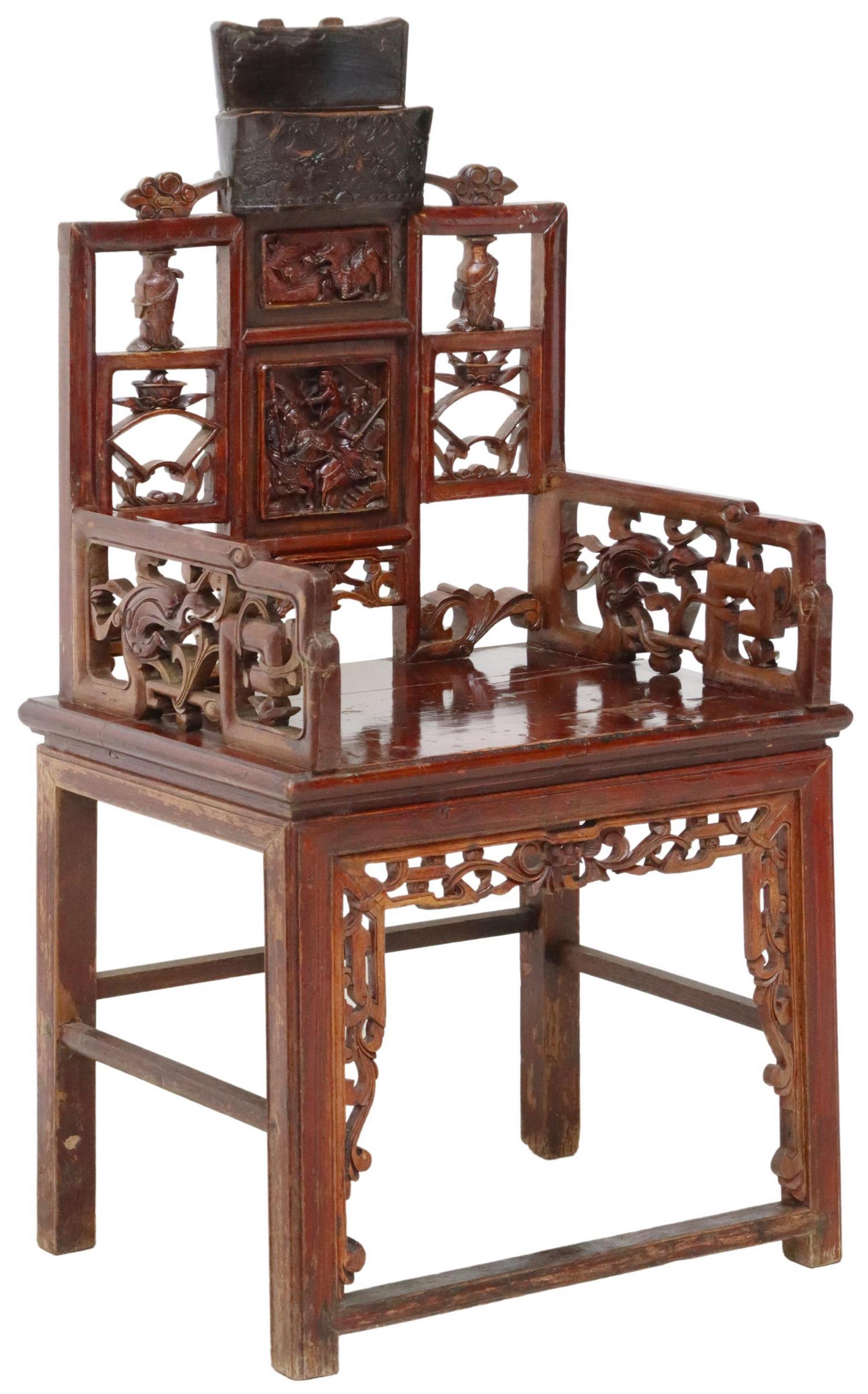CHINESE HIGHLY CARVED WOOD CHAIR FIGURAL SCENE: Chinese highly carved wood armchair, having lacquered finish, square back depicting figural battle scene, dragons, pierced back support with vases and fan shaped details, carved cloud accents to arms,