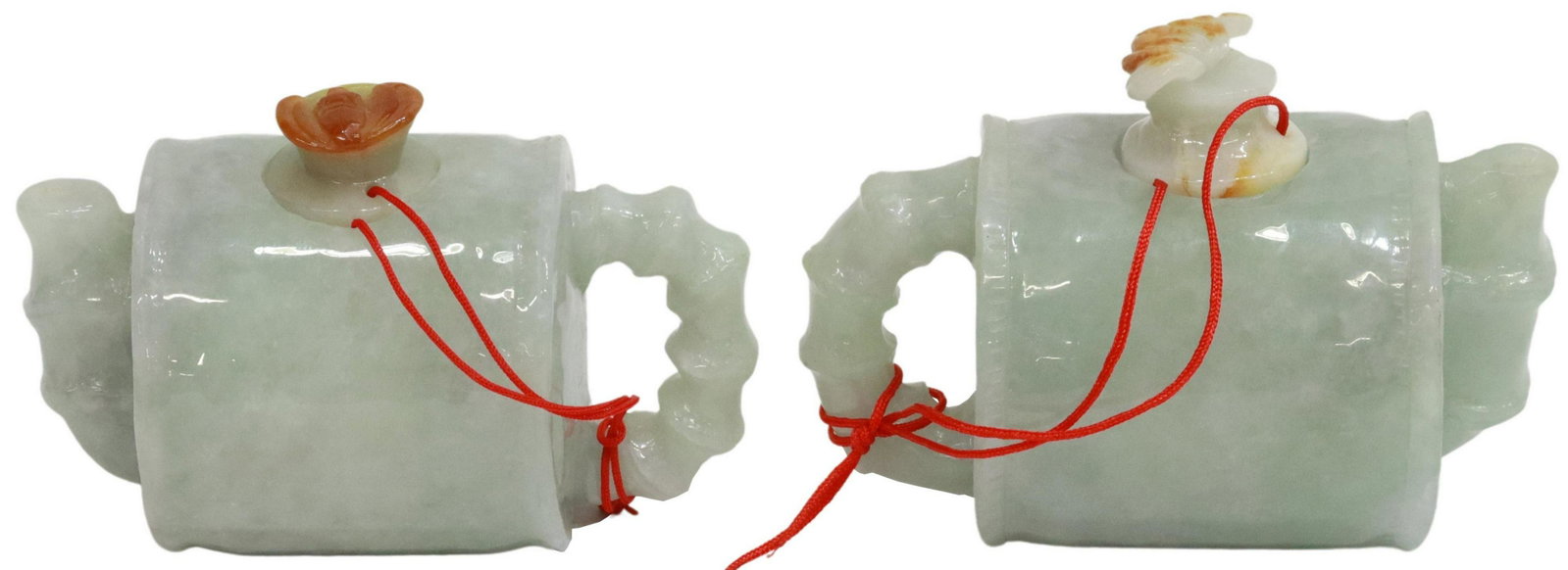 (2) CHINESE CARVED GREEN HARDSTONE WATER DROPPERS: (pair) Diminutive Chinese carved green hardstone water droppers, having cylindrical body, turned form handle and spout, circular lid with bat finial, approx 2"h, 3.75"w, 2.25"d; 1.25lbs total Start Pr