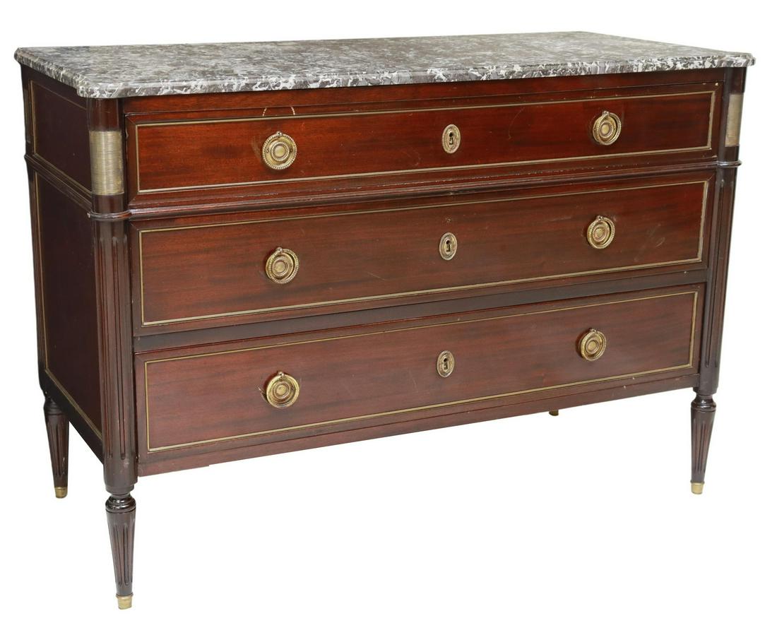 FRENCH LOUIS XVI STYLE MARBLE-TOP MAHOGANY COMMODE: French Louis XVI style mahogany commode, 20th c., shaped marble top, over three drawers, fluted corner posts, continuing to tapered legs, approx 32.25"h, 46.75"w, 20.75"d Start Price: $400.00