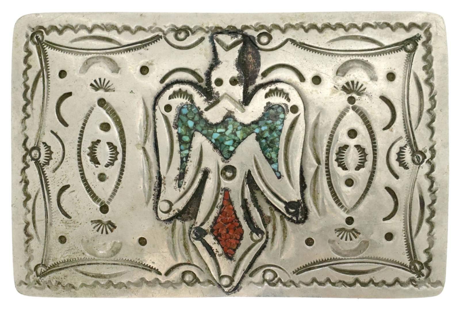 NATIVE AMERICAN CHIP INLAY PEYOTE BIRD BELT BUCKLE: Native American silver (content unknown) belt buckle, peyote bird with red coral and turquoise chip inlay, stamped designs, unmarked, approx 3"l, 2"w, 31.5 grams (inclusive of all materials) Start Pri
