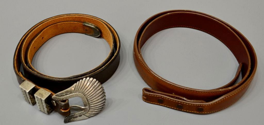 JAMES REID SANTA FE STERLING BUCKLE & LEATHER BELT: (lot of 2) A James Reid Ltd. of Santa Fe sterling silver belt buckle with end piece mounted on a 38" leather belt; (1) leather belt, lacking buckle, size 40; .75lb total Start Price: $100.00