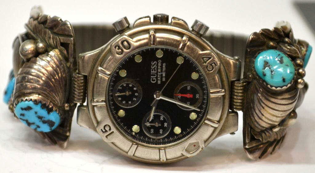 NAVAJO TURQUOISE, CLAW, CORAL SILVER WATCH BAND: Native American Navajo sterling, turquoise, coral and claw end pieces on a flex band, marked 'Navajo, Handmade, ES', joined to a Guess watch, 93 grams (inclusive of watch and band) Start Price: $50.00