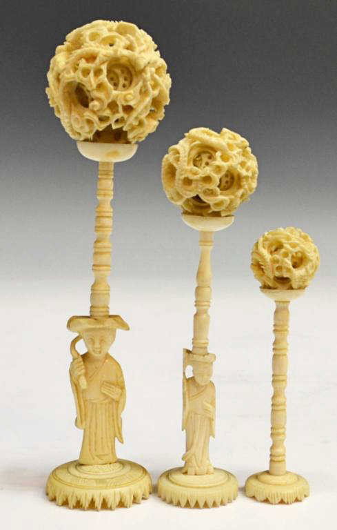 (3) GROUP OF CHINESE IVORY PUZZLE BALLS ON STANDS: **This item will not be shipped Internationally** (lot of 3) Chinese carved ivory puzzle balls, the exterior of each carved with a writing dragon, interior layers with star pattern, two on figural sta