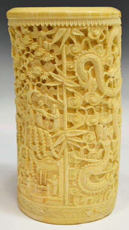 PROFUSELY CARVED CHINESE ELEPHANT TUSK: **This item will not be shipped Internationally** Chinese carved ivory elephant tusk, covered with sinuous dragons with clouds, many small figures and dwellings, damage at one side, 7.5"h, 4"w, 3.25"d