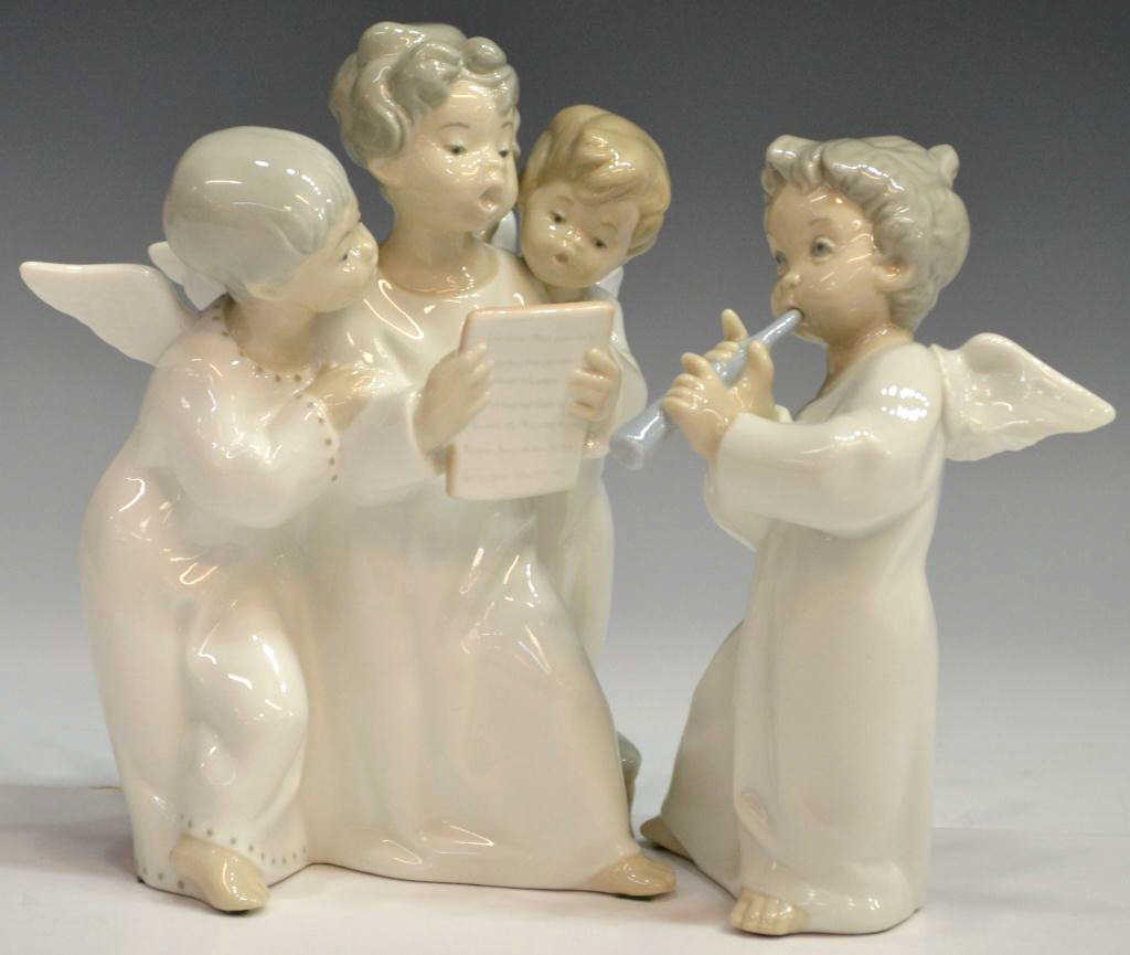 (2) LLADRO PORCELAIN MUSICAL ANGELS: (lot of 2) Lladro porcelain angel figural groups: (1) " Angels Group," #4542, issued: 1970, retired: 2005, darling group of singing angels, center angel holding music sheet, slight repair to single wi