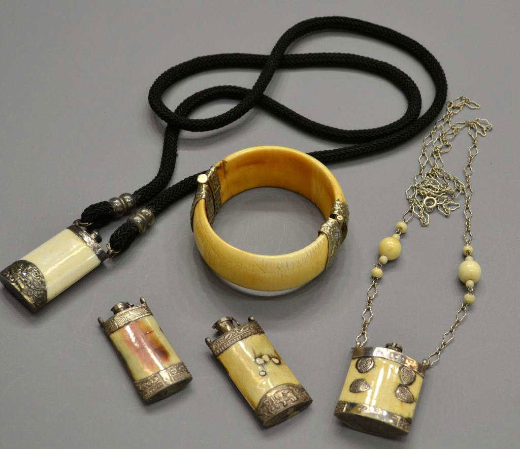 GROUP CARVED BONE, IVORY & SILVER JEWELRY: *This lot will not be shipped Internationally**(lot of 5) Bone, ivory and silver jewelry group comprising (1) bracelet and (4) carved bottles, two hung from cord and link necklaces, .25lb total Start