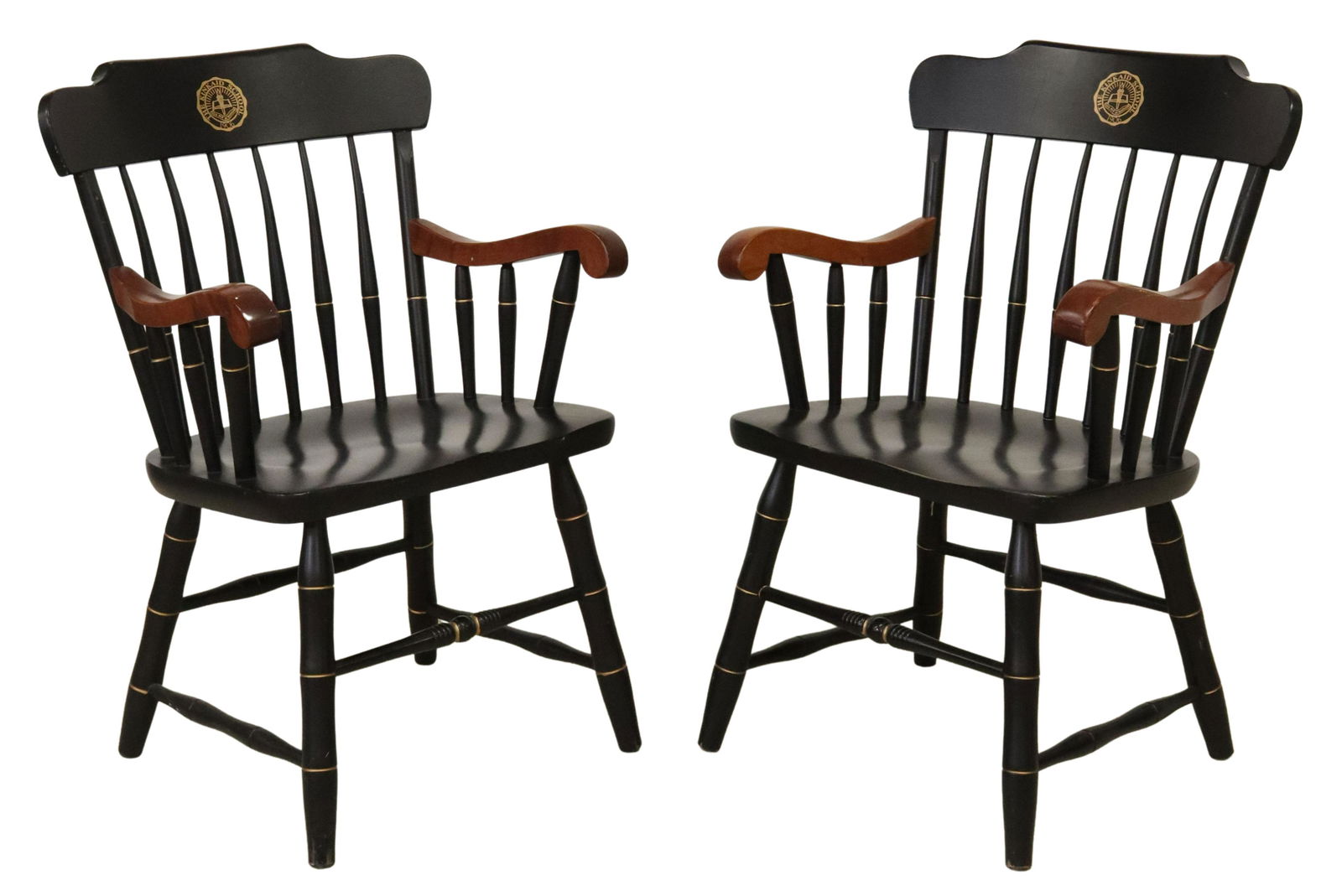 (2) KINKAID SCHOOL OF HOUSTON WINDSOR STYLE CHAIRS: (pair) Windsor style carved wood armchairs, S. Bent and Brothers, 21st c., bearing the seal of the Kinkaid School in Houston, Texas, having curved crest rail with spindle supports, scrolled handholds,