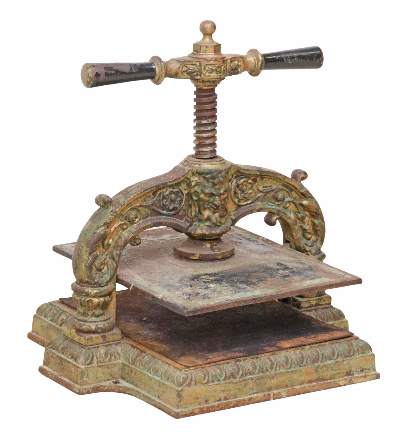 VICTORIAN SATYR MASK CAST IRON BOOK PRESS: Victorian cast iron book press, late 19th/ early 20th c., foliate supports centering satyr mask, rising on pedestal base with egg and dart trim, approx 14.75"h, 14"w, 12"d Start Price: $300.00