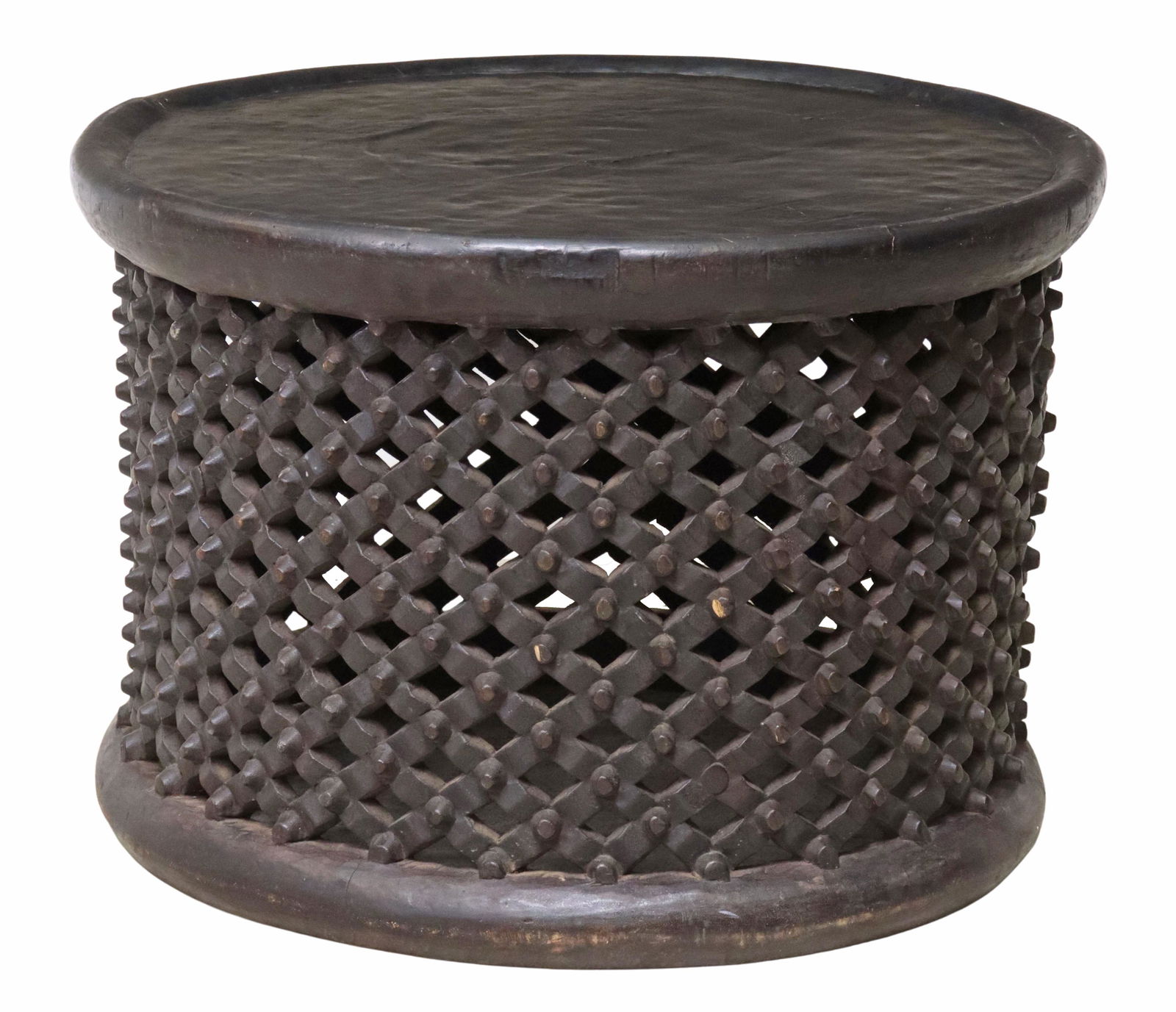 ANDRIANNA SHAMARIS 'AFRICAN' LATTICE COFFEE TABLE: "African" ebonized tray coffee table, Andrianna Shamaris Incorporated, round top, over pierced lattice design, approx 19.5"h, 28.5"diam Start Price: $150.00