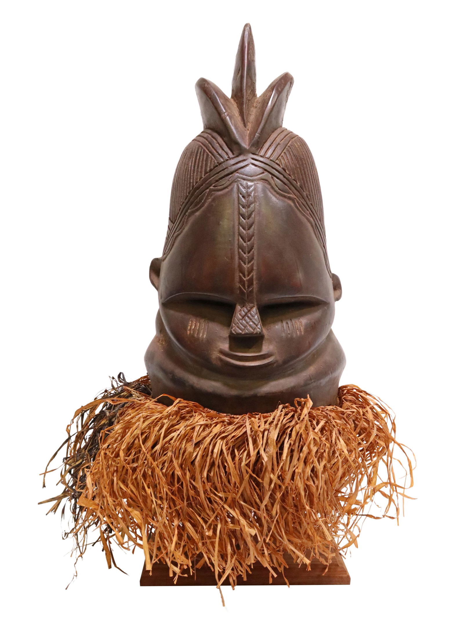 AFRICAN SANDE SOCIETY MENDE CARVED HELMET MASK: African tribal carved wood helmet mask, Sande society of the Mende peoples, Sierra Leone, West Africa, high-domed coiffure, over small pursed lips, with raffia fringe, slight remnants of red and blue