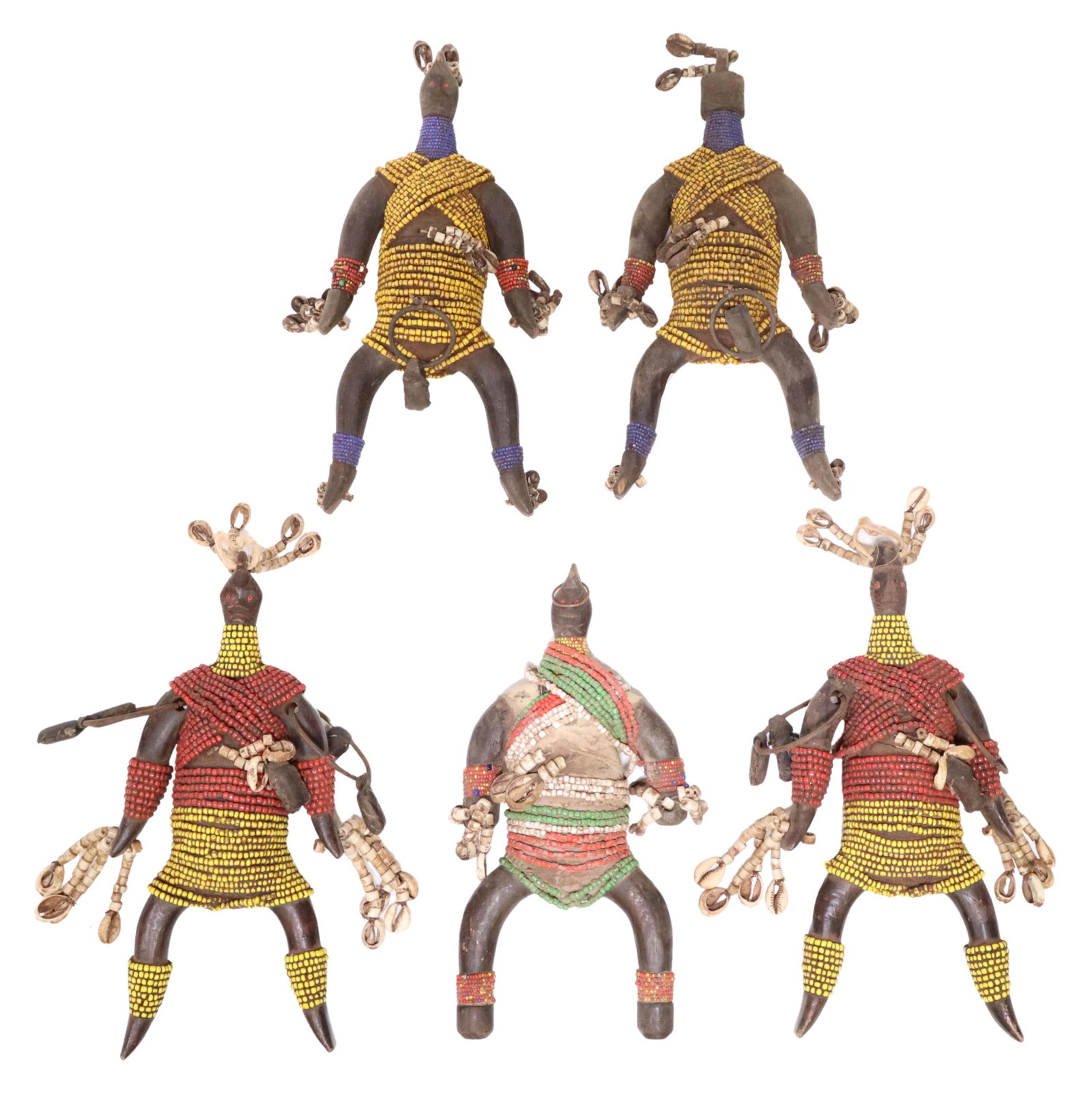 (5) AFRICAN NAMJI BEADED WOOD FERTILITY DOLLS: (lot of 5) African Namji fertility dolls, Cameroon, each carved wood, covered with various colored beads, cowrie shells and metal mounts with leather packets, some loss to beads, each: approx 11.75"h,