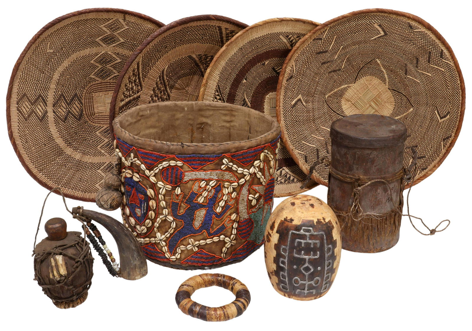 (LOT) AFRICAN BEADED & WOVEN BASKETS, DRUM, VASE: (lot) Group of African items including (4) woven trays, largest: 19"diam, (1) drum, (1) horn with wood flask, (1) beaded fabric basket with cowry shell accents, figural masks and animals, fabric stain