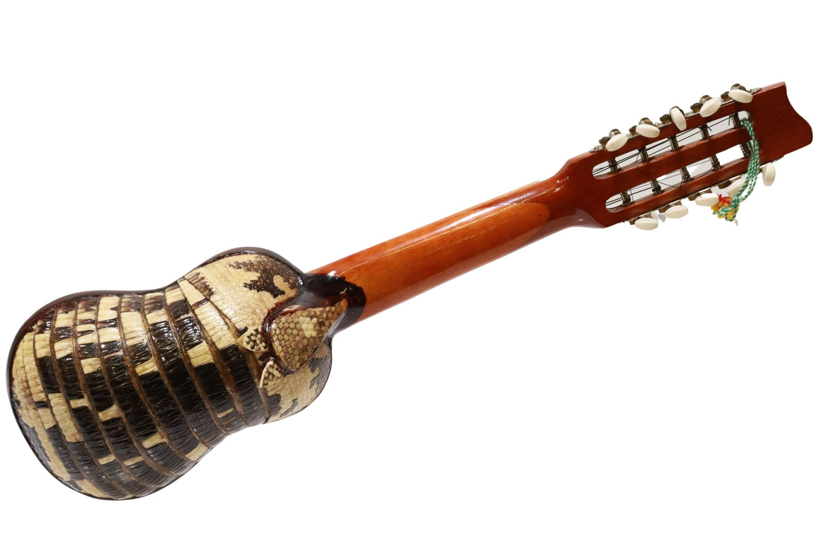 ARMADILLO SHELL CHARANGO 10-STRING INSTRUMENT: Charango ten-string instrument, having armadillo shell back, wood frame with painted geometric motifs, five courses of two strings each, unmarked, approx 26"h, 7"w, 3.5"d, 0.75lbs Start Price: $60.00