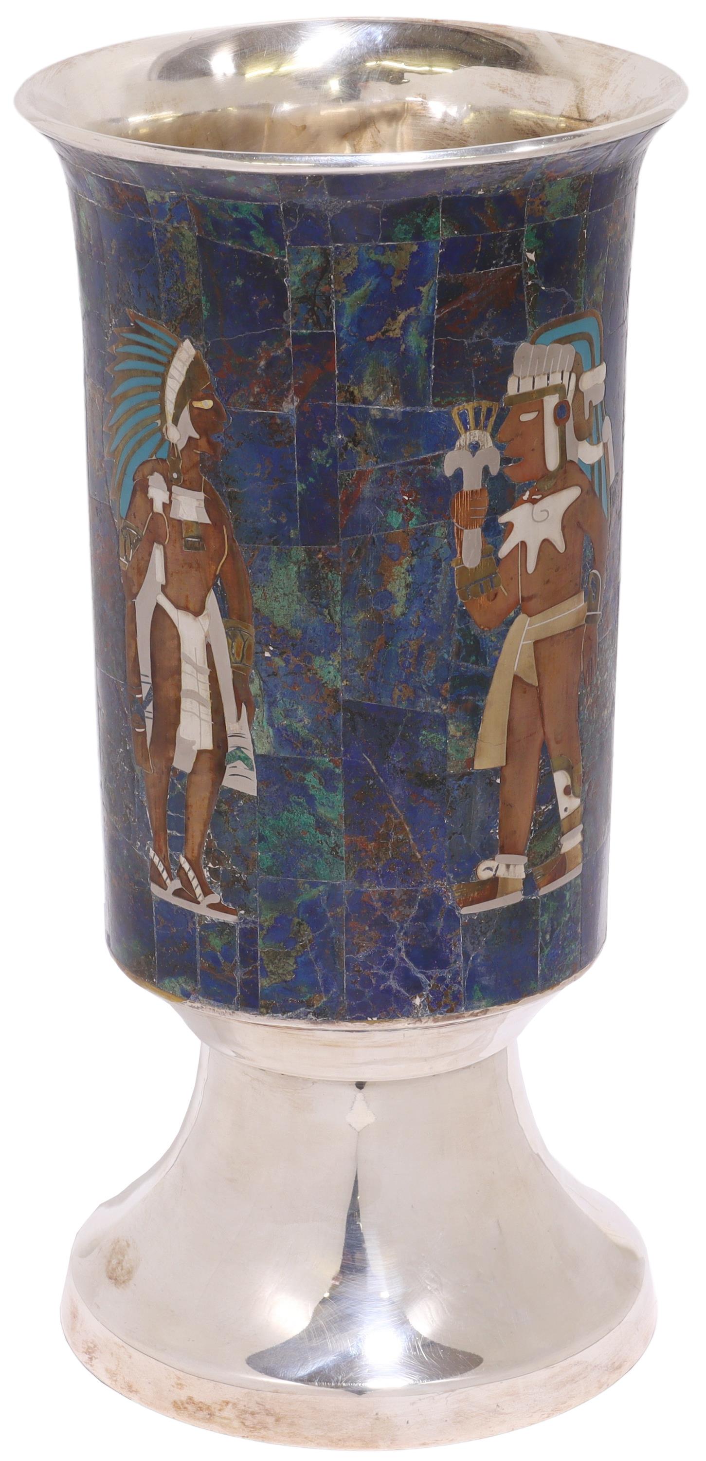 LOS CASTILLO PRE-COLUMBIAN STYLE STONE INLAY VASE: Silverplate vase, Los Castillo, Taxco, Mexico, 20th c., mixed metal pre-Columbian inspired figural design, against a stone-inlaid ground, approx 11.75"h, 6"diam, 3.25lbs (for shipping purposes only) S