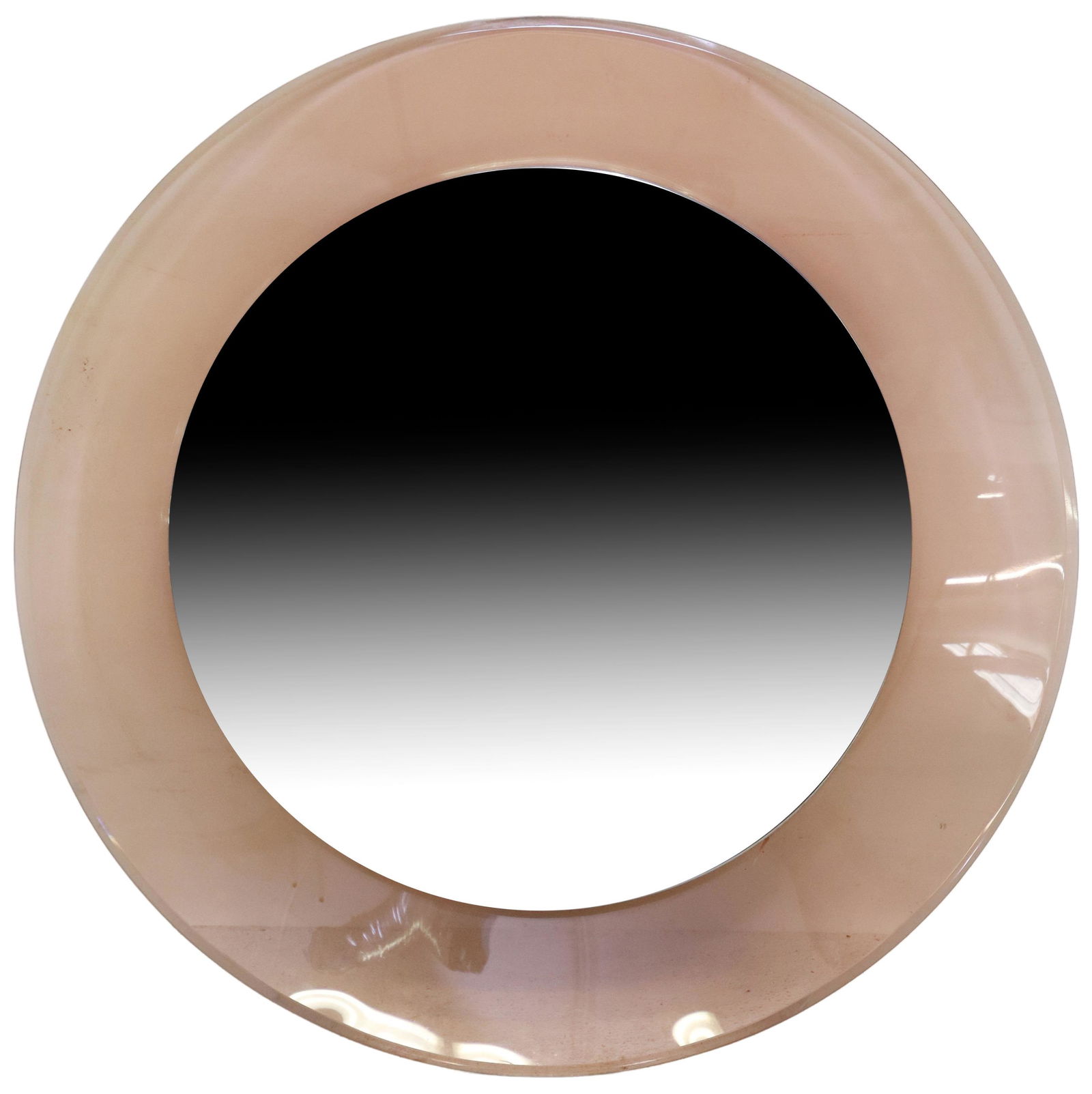 FONTANA ARTE (ATTR) MID-CENTURY GLASS ROUND MIRROR: Italian mid-century modern glass mirror, attributed to Max Ingrand (French, 1908-1969) for Fontana Arte, c.1960s, circular peach-colored glass frame, centering beveled mirror plate enclosed in metal b