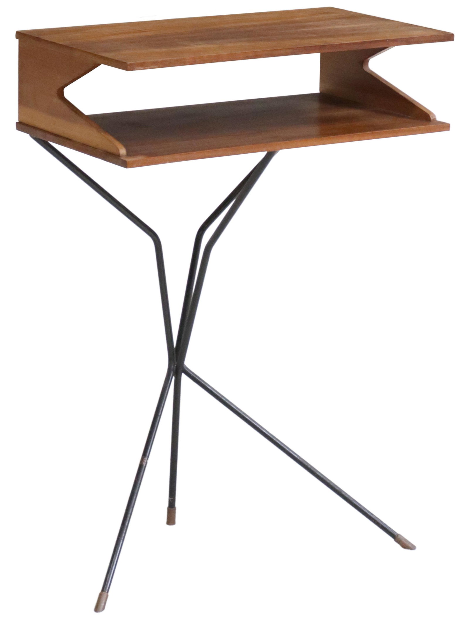 ITALIAN MID-CENTURY MODERN TEAK & IRON SIDE TABLE: Italian mid-century modern teak nightstand/ side table, c.1950s, having two-tier rectangular top, rising on iron supports, ending in brass-capped feet, approx 28"h, 17.75"w, 9.75"d Start Price: $150.0